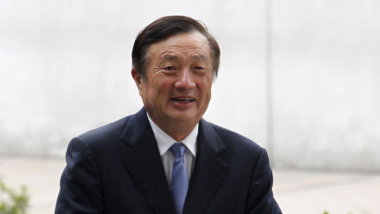 Huawei CEO and founder Ren Zhengfei walks inside Huawei’s headquarters in Shenzhen