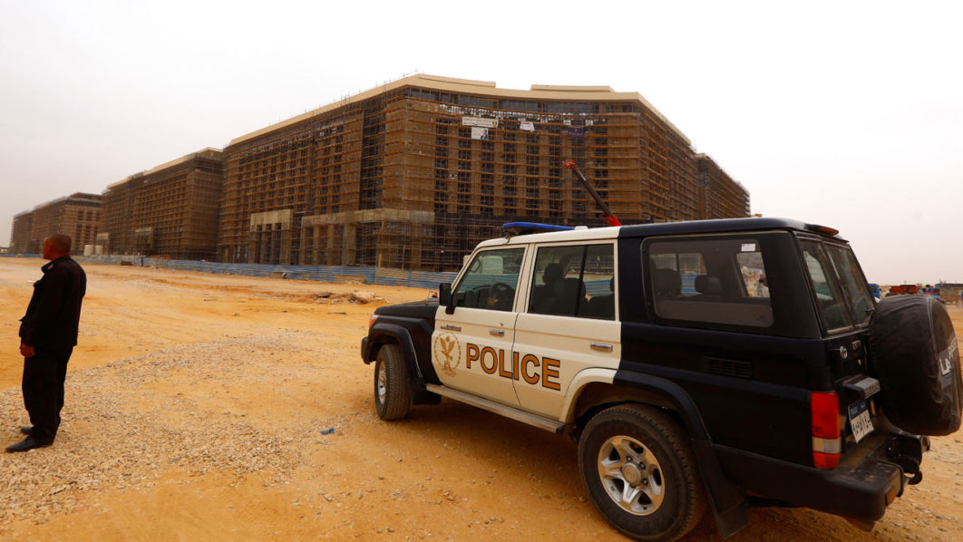 Egyptian police guard in front of the new government district in NAC east of Cairo