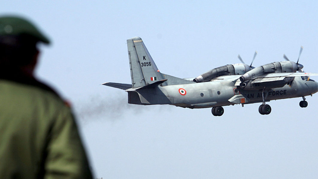 FILE PHOTO: A soldier stands guard as an Indian Air Force AN-32 transport aircraft carrying security personnel takes-off from the technical airport in Jammu
