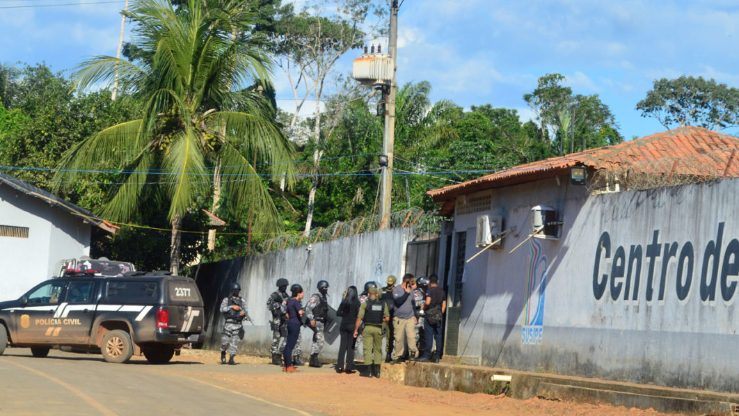 Policemen and soldiers are seen in front of a prison after a riot, in the city of Altamira