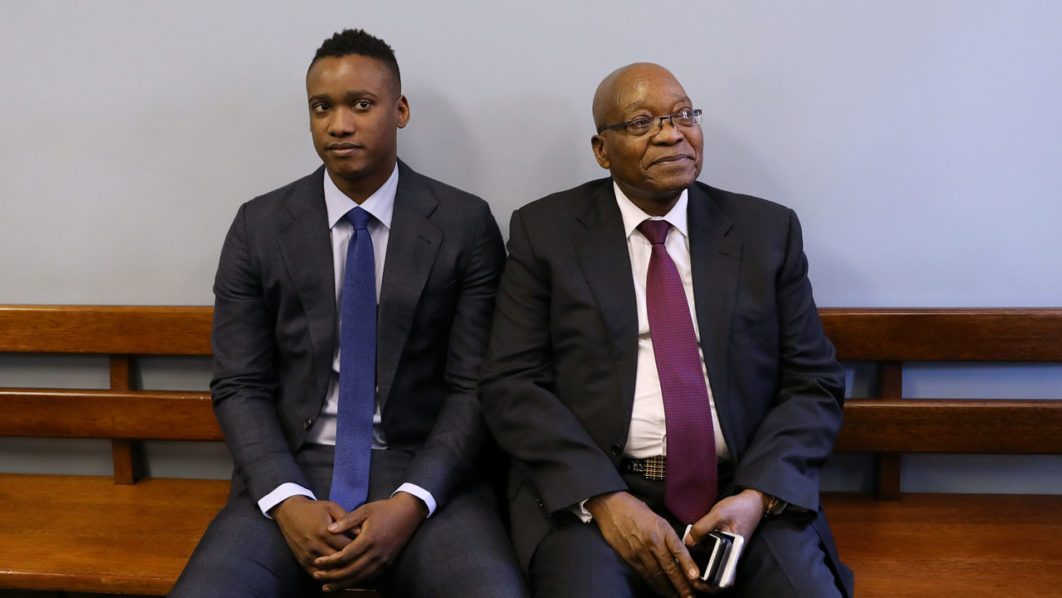 Duduzane Zuma sits with his farther, former South African president Jacob Zuma, ahead of Duduzane’s appearance at the Specialised Commercial Crimes Court in Johannesburg
