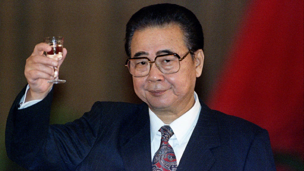 FILE PHOTO: China’s Premier Li Peng toasts the guests at an official banquet in Beijing’s Great Hall of the People