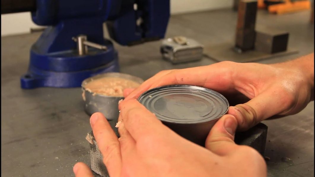 A man with a canned product Photo – YouTube