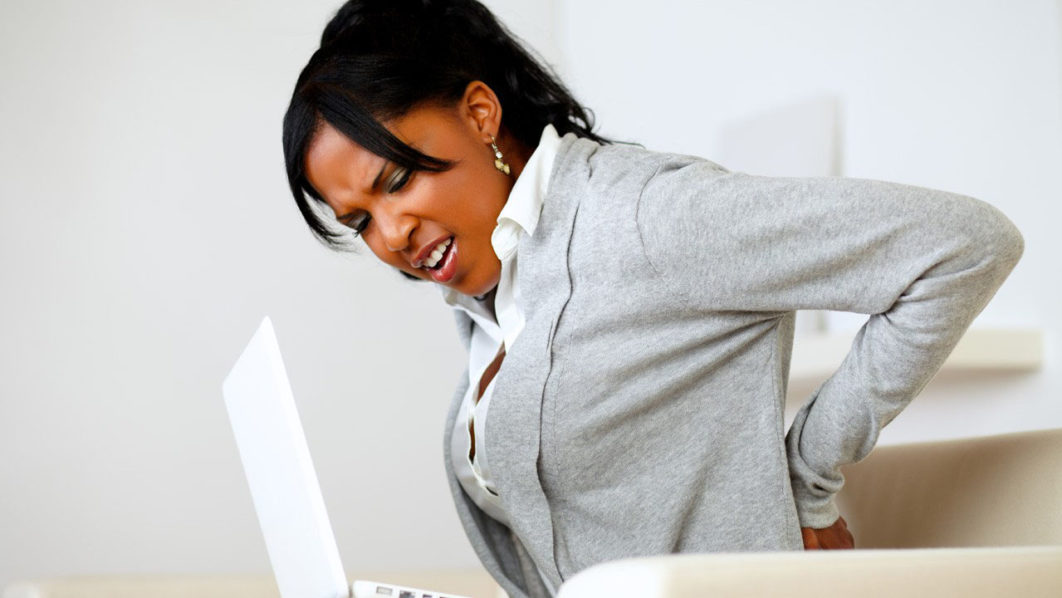 African American woman suffering back pain Photo = Ebony Magazine