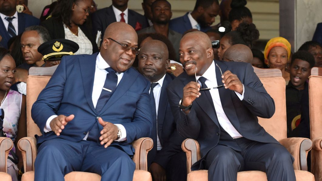 FILE PHOTO: Democratic Republic of Congo’s outgoing President Joseph Kabila sits next to his successor Felix Tshisekedi during an inauguration ceremony in Kinshasa