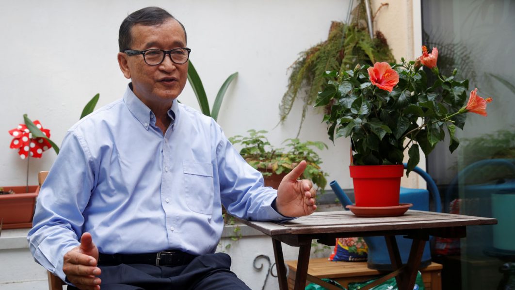 Former president of the dissolved opposition Cambodia National Rescue Party (CNRP) Sam Rainsy, who is living in exile, speaks during an interview with Reuters on his terrace in Paris