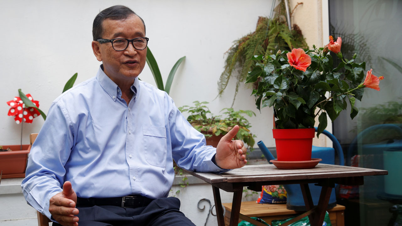 Former president of the dissolved opposition Cambodia National Rescue Party (CNRP) Sam Rainsy, who is living in exile, speaks during an interview with Reuters on his terrace in Paris