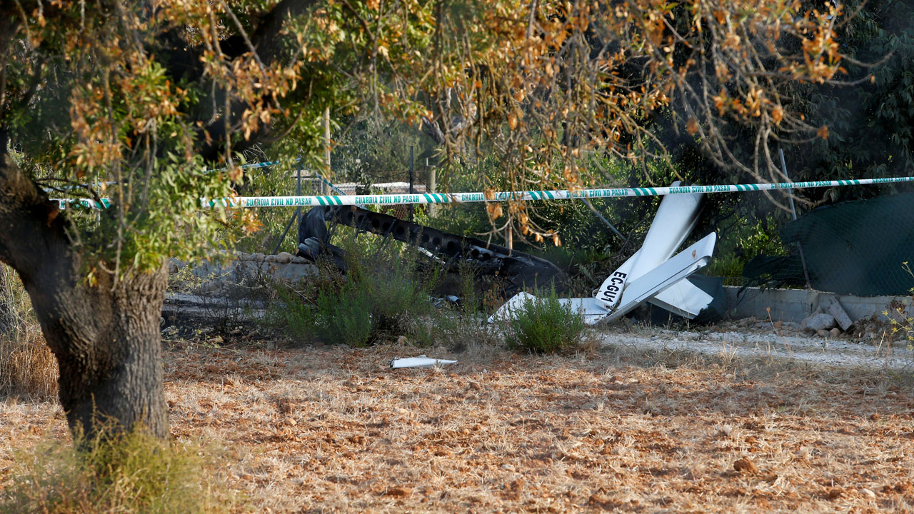 Debris and wreckage parts lay on the ground after a collision between an aircraft and a helicopter near the Village of Inca in the Spanish island of Mallorca