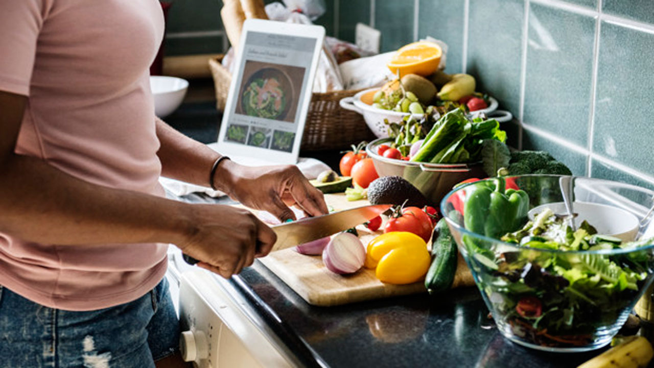 black-woman-cooking-kitchen_53876-70424