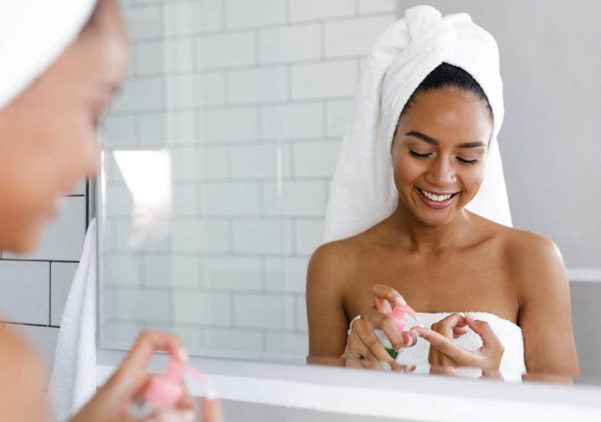 lady applying a facial moisturiser