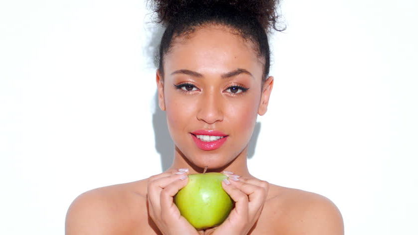 Woman Holding Apple – ShutterStock