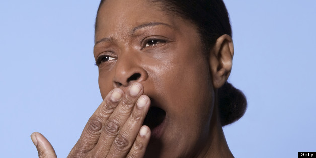 An African American yawning