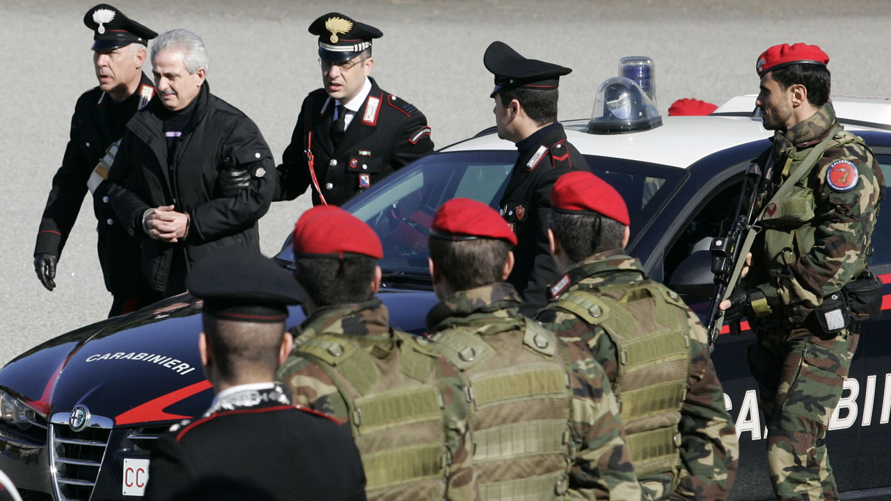 Officers of Italy’s Carabiniere escort suspected ‘Ndrangheta crime syndicate boss Condello to a waiting helicopter in Reggio Calabria