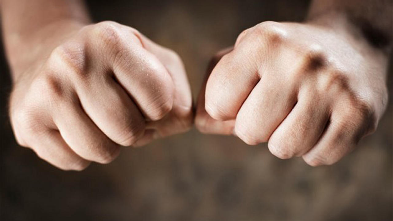 CMWPYY Man clenching his hands to fists.
