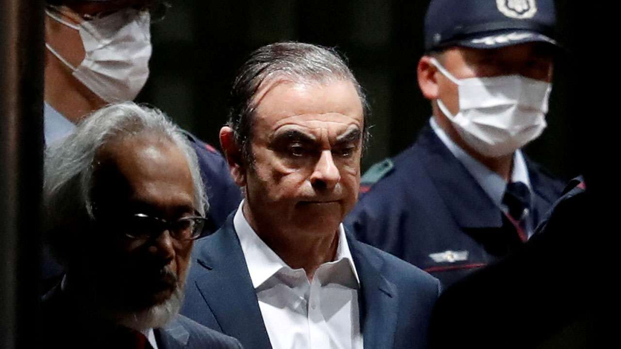 FILE PHOTO: Former Nissan Motor Chairman Carlos Ghosn leaves the Tokyo Detention House in April