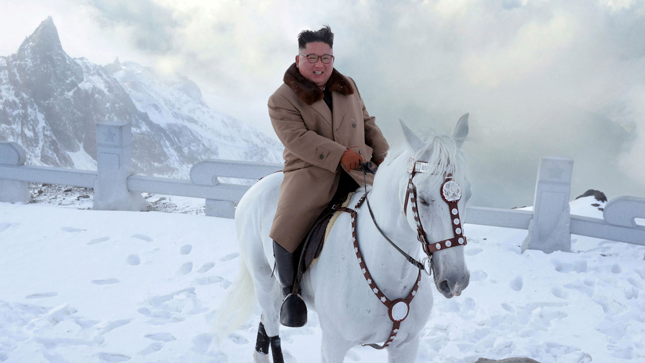 North Korean leader Kim Jong Un rides a horse during snowfall in Mount Paektu