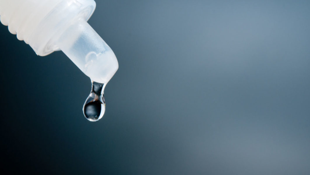 Close-Up Of Liquid Dropping From Pipette