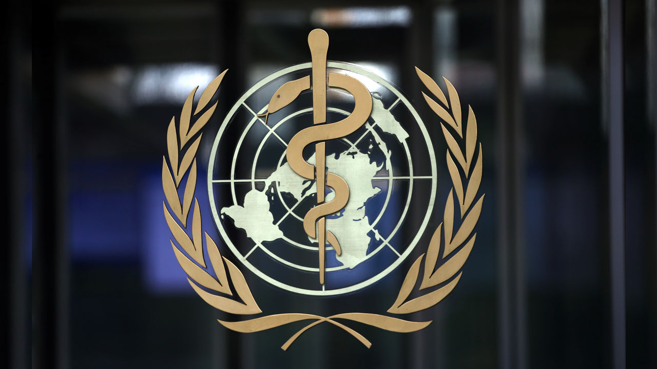 A logo is pictured on the headquarters of the WHO in Geneva