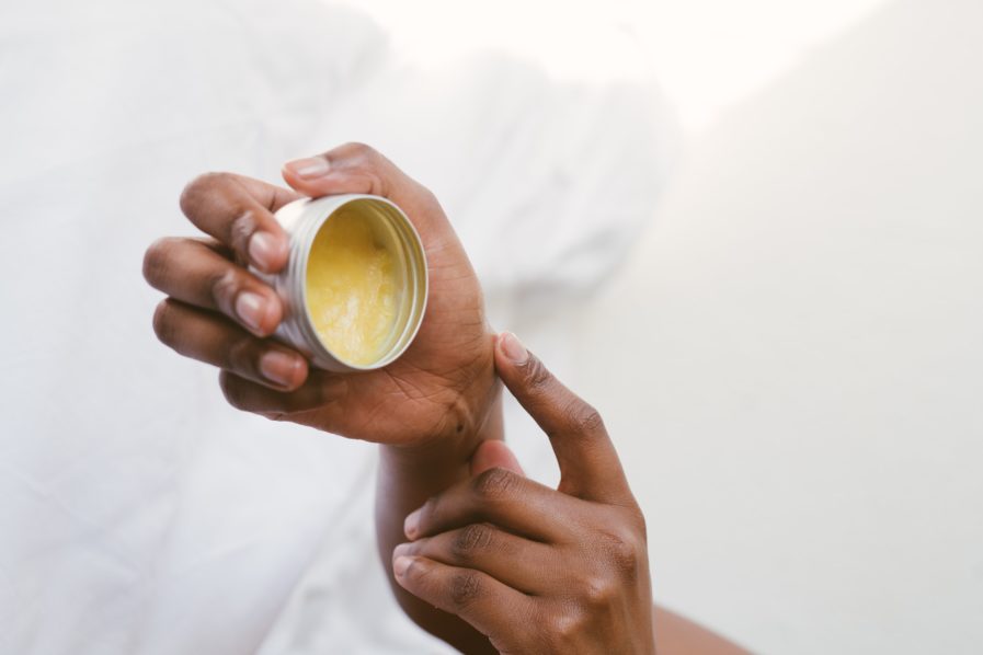 person-holding-a-hand-cream-3059398