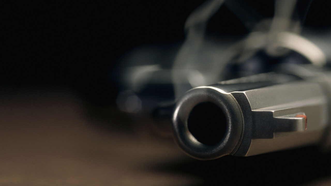 Smoking gun lying on the floor, revolver