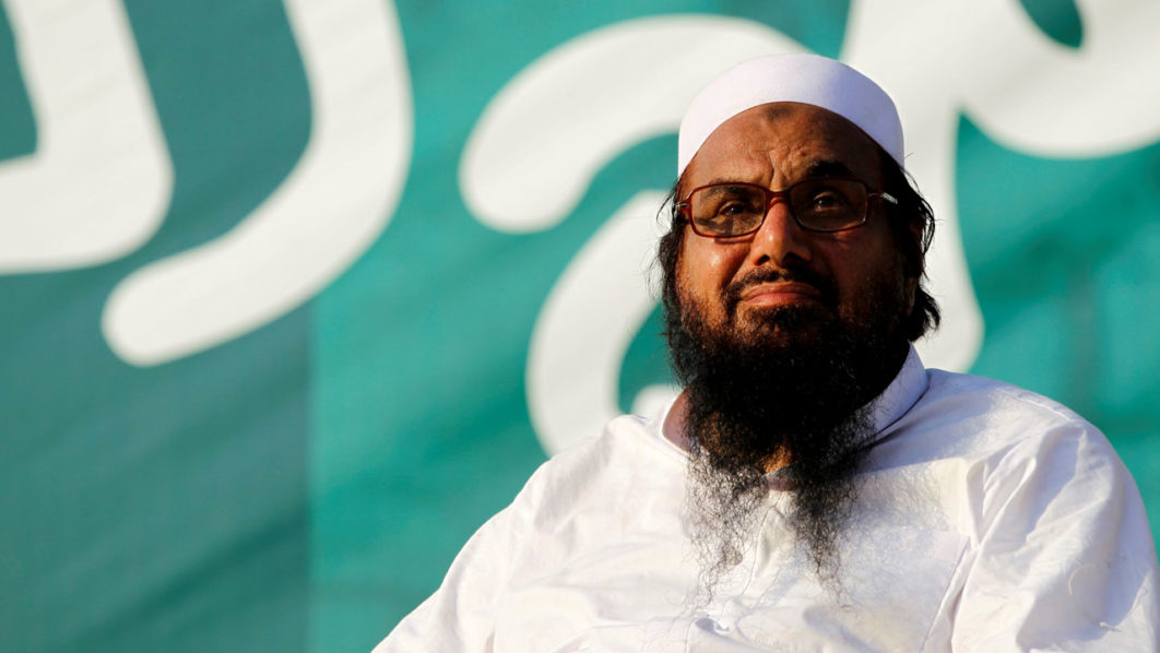 FILE PHOTO: Hafiz Muhammad Saeed, chief of the banned Islamic charity Jamat-ud-Dawa, looks over the crowed as they end a “Kashmir Caravan” from Lahore with a protest in Islamabad