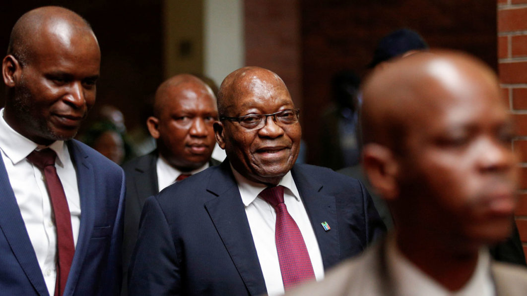 FILE PHOTO: Former South African President Jacob Zuma arrives at the High Court where he faces charges that include fraud, corruption and racketeering, in Pietermaritzburg