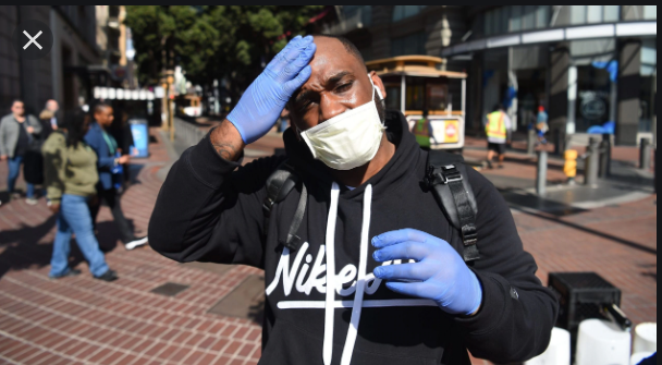 African American man in public with a face mask