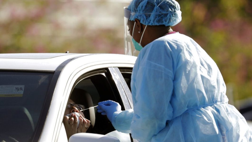 Health worker administering chloroquine WFTV
