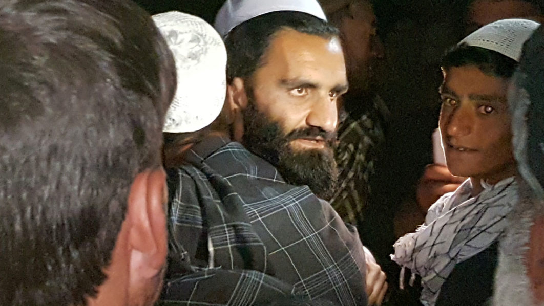 A newly freed Taliban prisoner hugs his relatives outside Bagram prison, north of Kabul