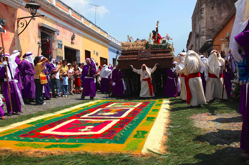 Coloured sawdust and flower petals used as an Easter carpet in Guatemala. Photo Room Suggestino