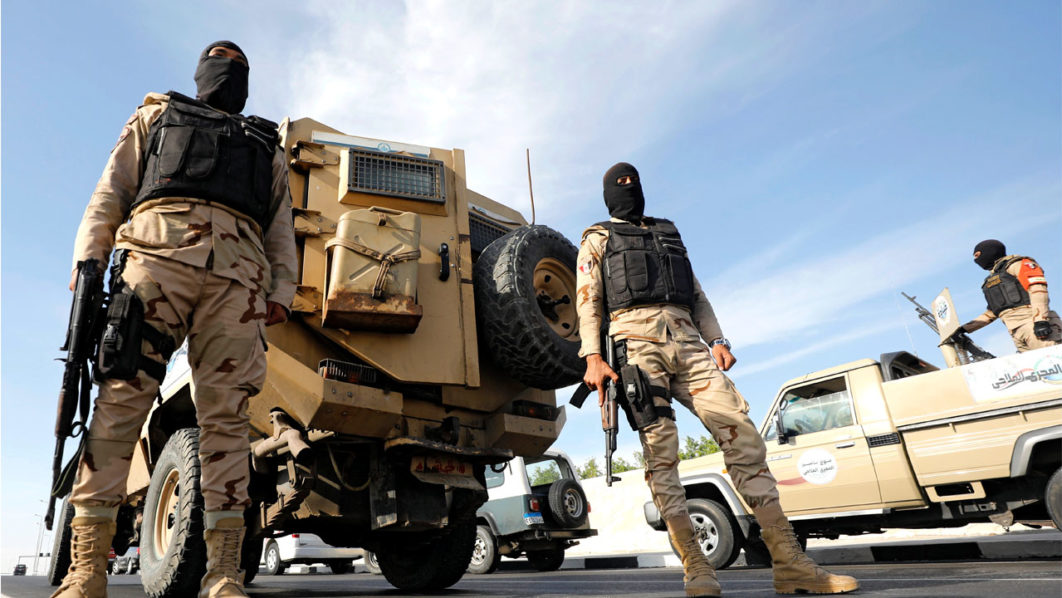 Army soldiers guard the entrance of tunnels and the Suez Canal area, in Ismailia