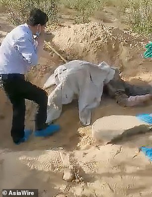 Paralysed woman being rescued from grave