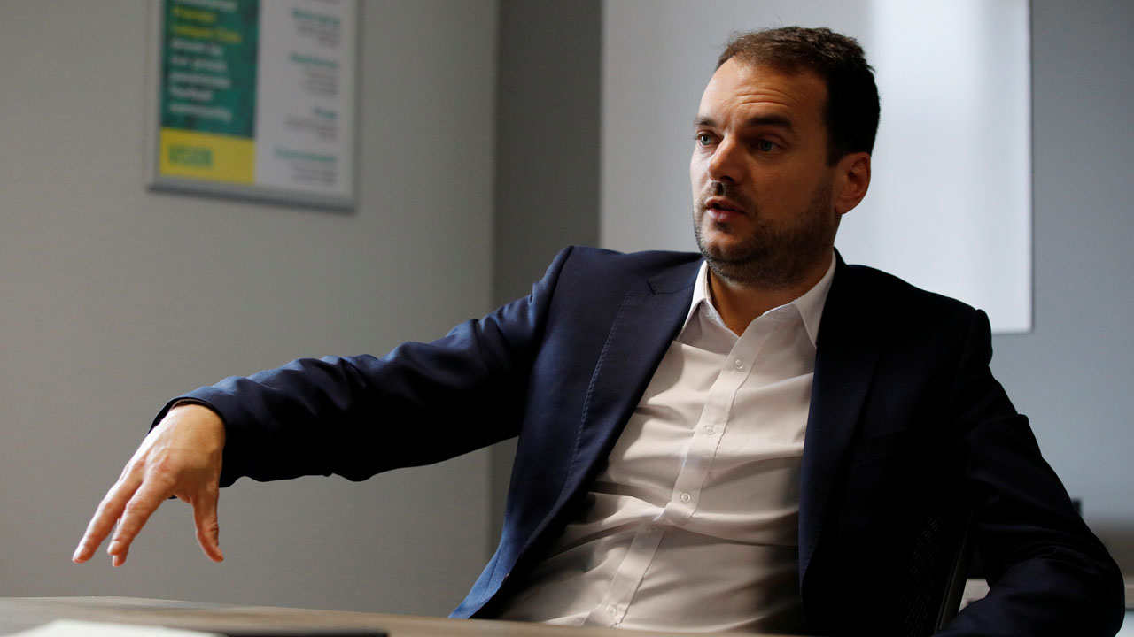 Norwich City’s Sporting Director Stuart Webber gestures during an interview at the club’s training ground in Norwich