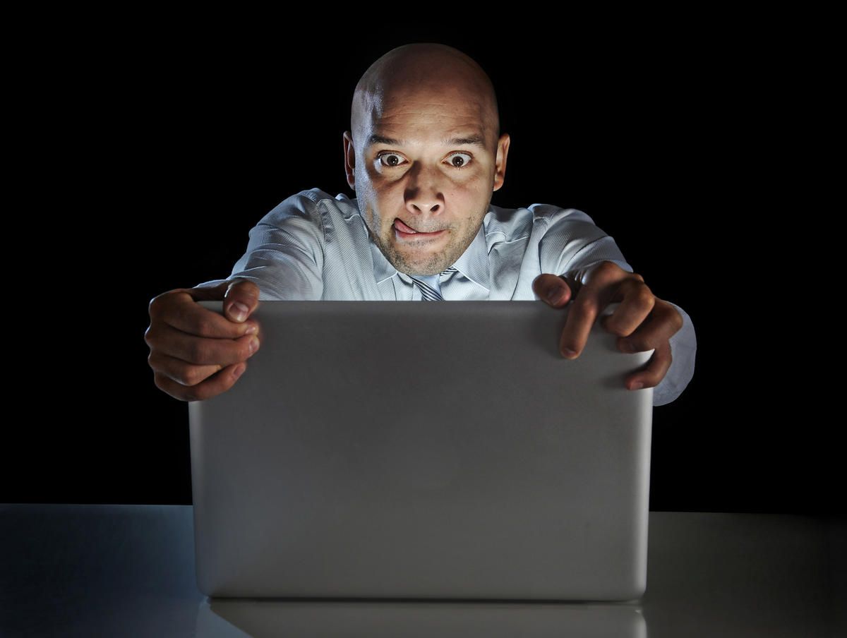 Man watching his laptop screen