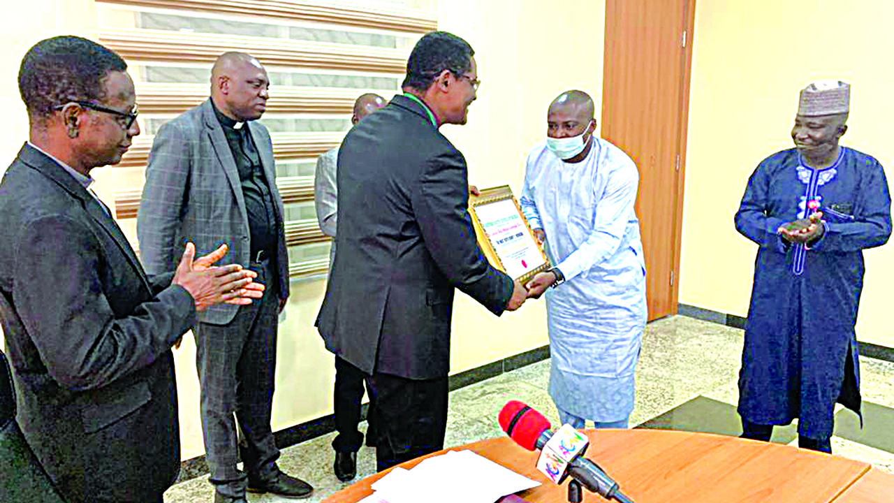 Ndukuba receiving the Award
