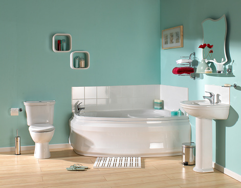 Interior of large luxurious bathroom in pastel green