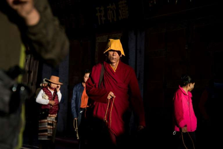 a-group-of-people-wearing-costumes-beijing-insists-it-peacefully-liberated-tibet-in-1951-and-brought_201455_