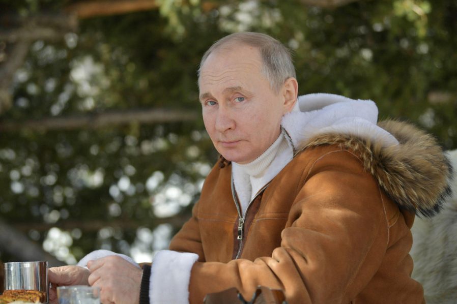 Vladimir Putin poses for a photograph while on a break in a taiga forest – Alamy Stcok Photo