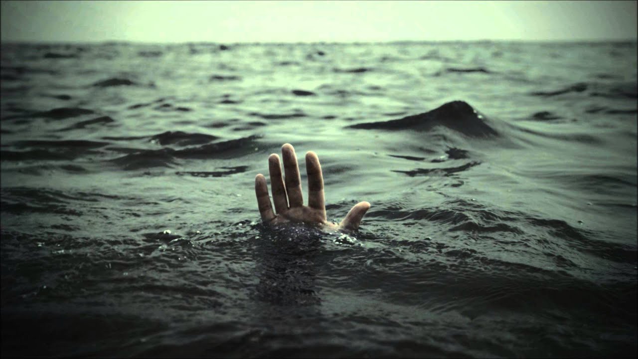 A hand coming out of water. Photo Steve Roden