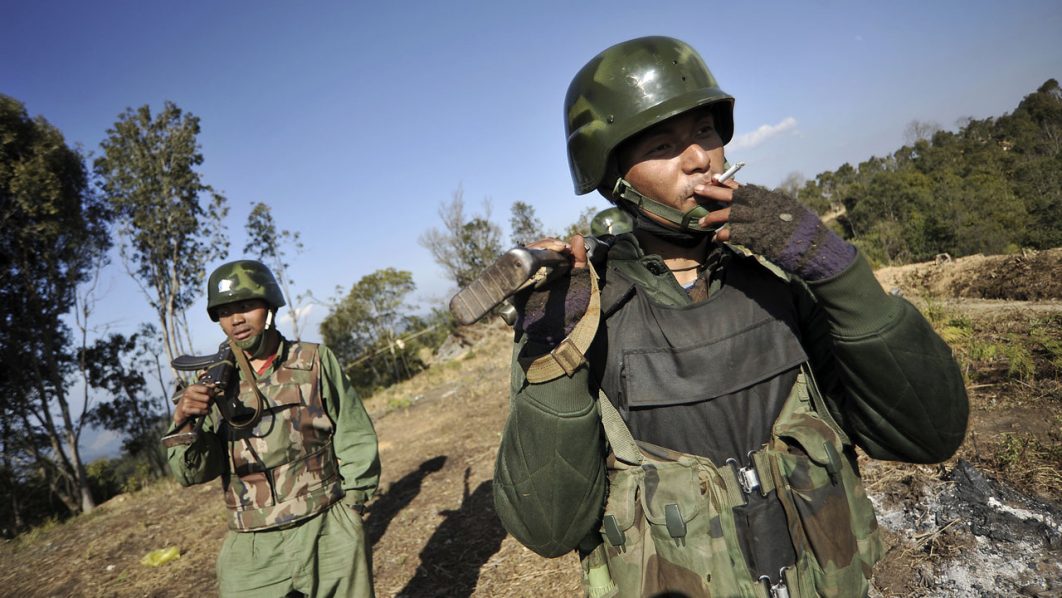 Soldiers of Kachin Independence Army (KIA) man their position at front line near Mai Ja Yang in Kachin state