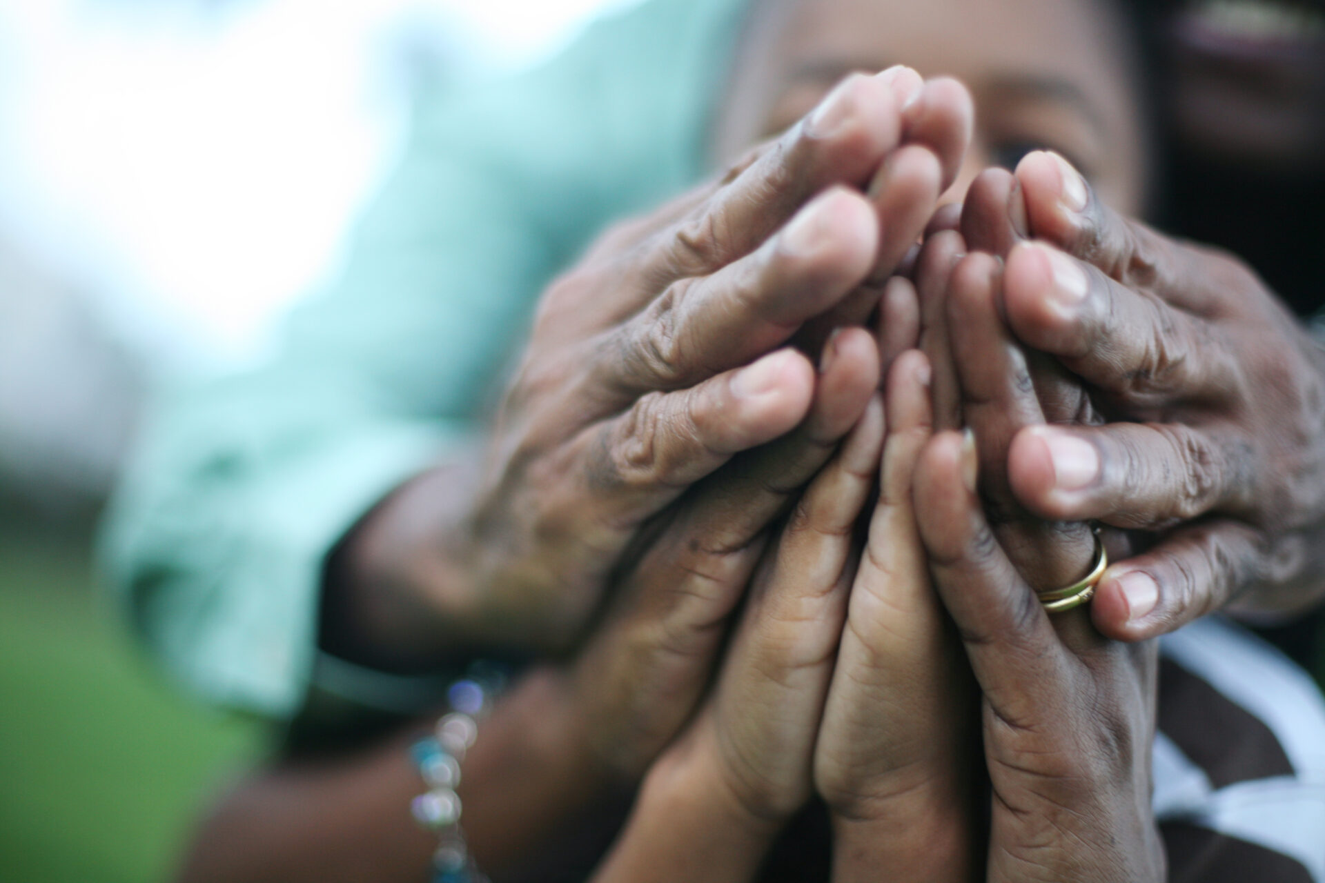 family of three praying together
