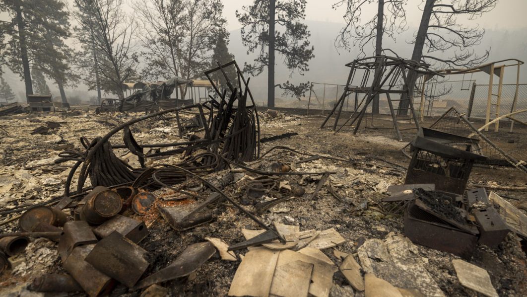 Year’s largest fire burns through dry terrain to destroy California homes