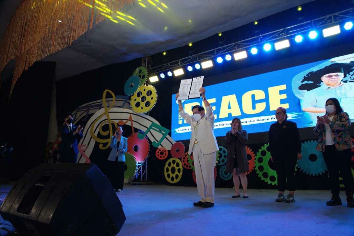 Chairman-Lee-holding-the-DPCW-Resolution-of-Davao-de-Oro-1170×780