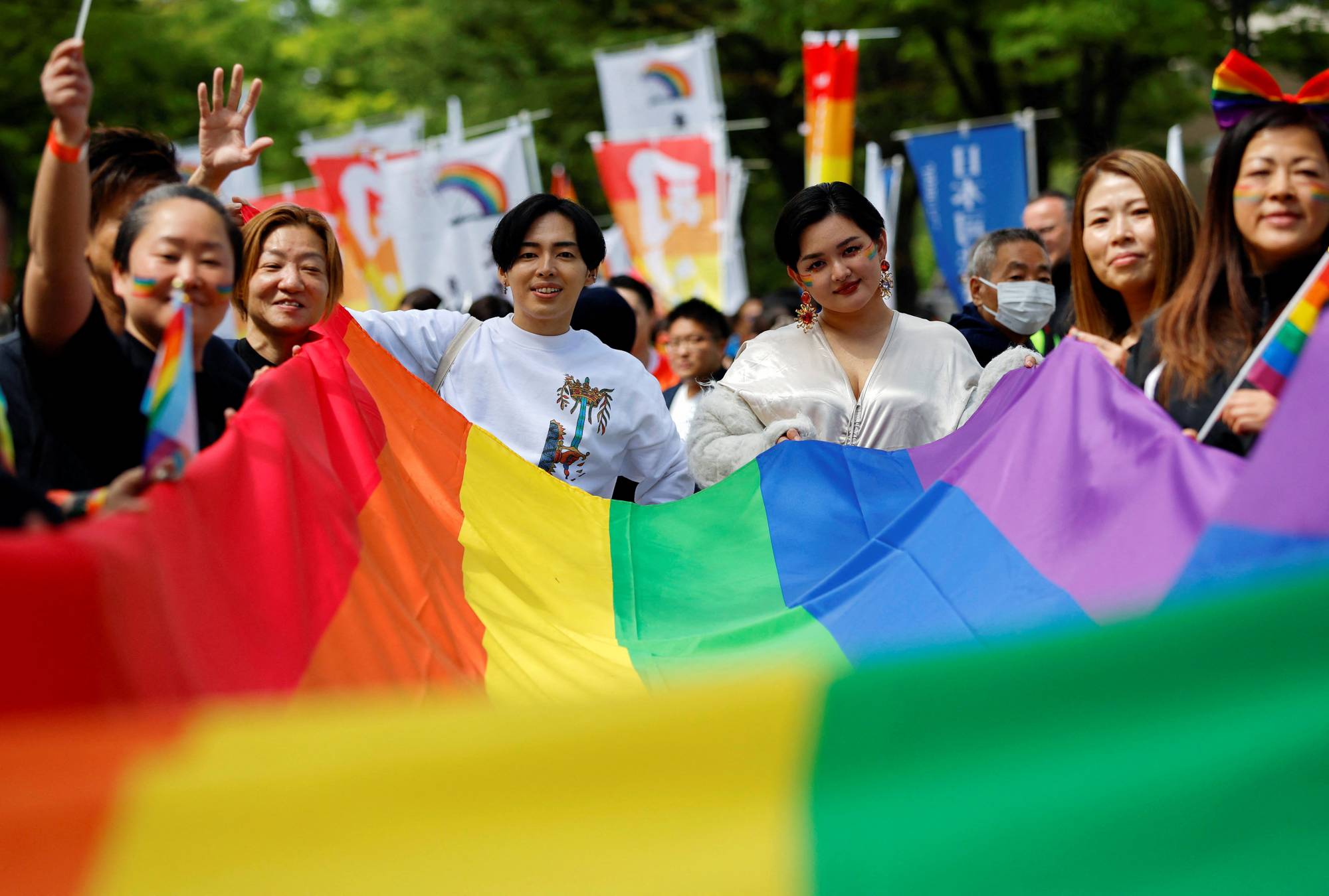 Participants march during the Tokyo Rainbow Pride parade, celebrating advances in LGBTQ rights and calling for marriage equality, in Tokyo