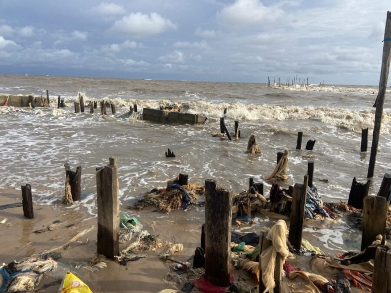 The_remains_of_buildings_lost_to_the_sea_in_Ayetoro-scaled-e1686046198185