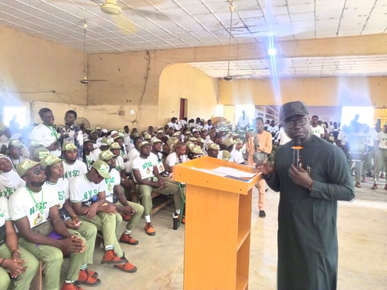 Minister of State for Youth Development, Mr Ayodele Olawande, addressing Corps members at the NYSC Orientation Camp in Yipata, Kwara.