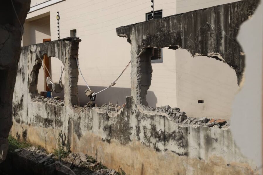A building undergoing demolition by officials of Lagos State Government