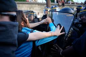 Police officers face protesters on Concorde square during a protest in Paris, France, June 30, 2023.