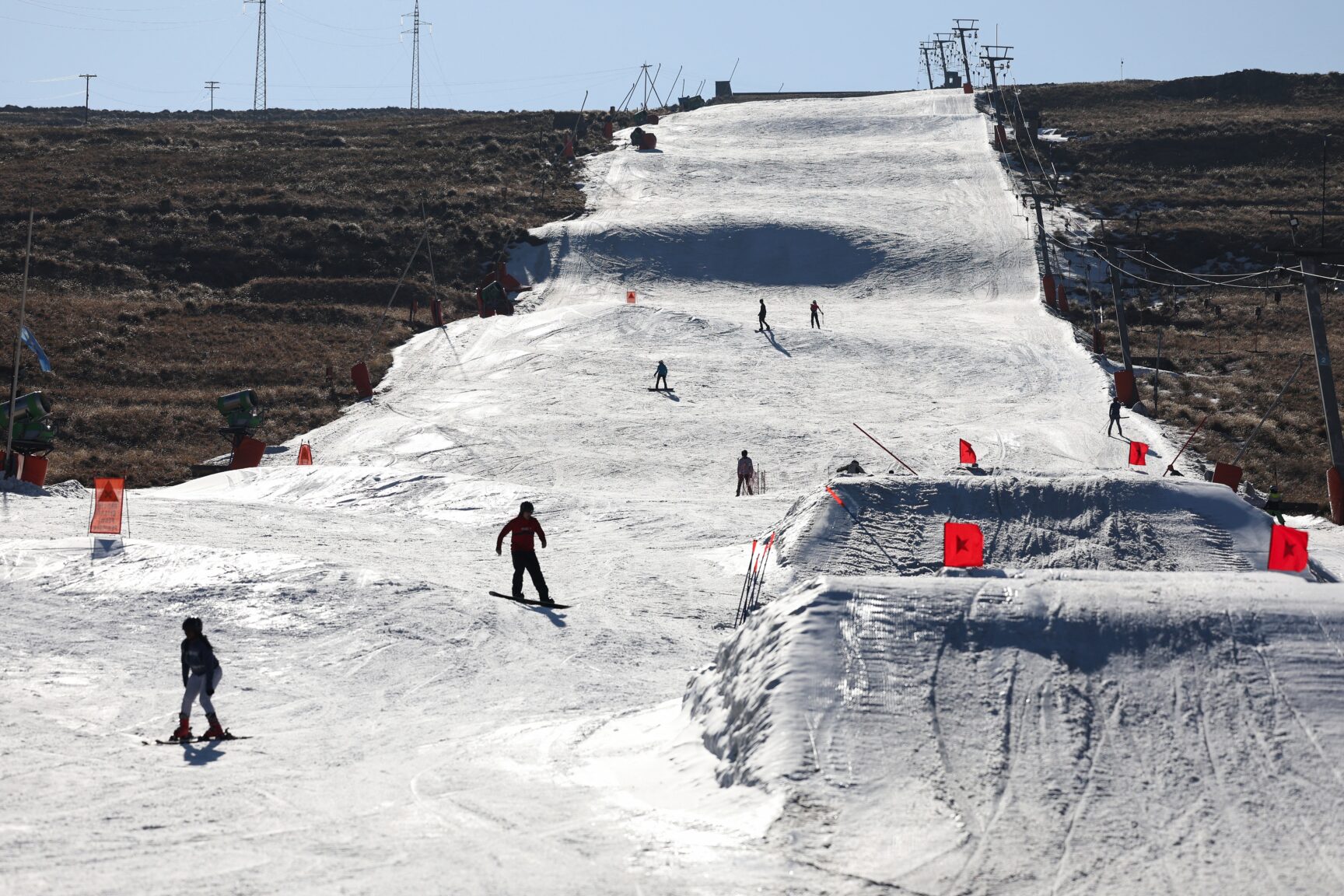 Image of people skiing on artificial snow