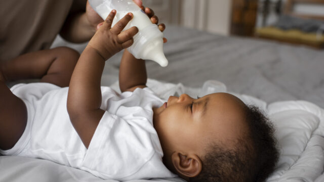 side-view-parent-feeding-baby (1)
